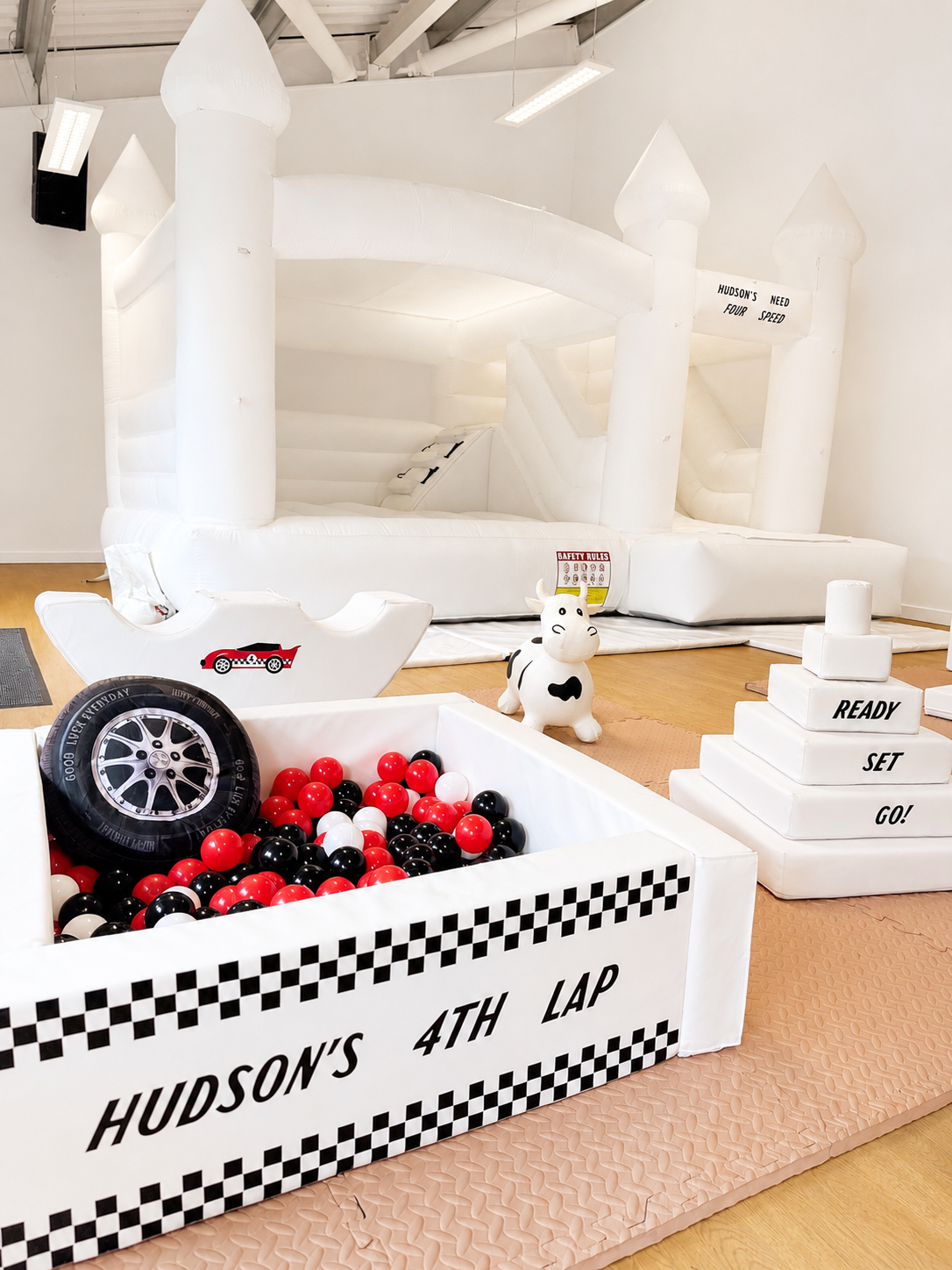 Hudson's 4th Lap — race car themed soft play and bouncy castle with personalised vinyl